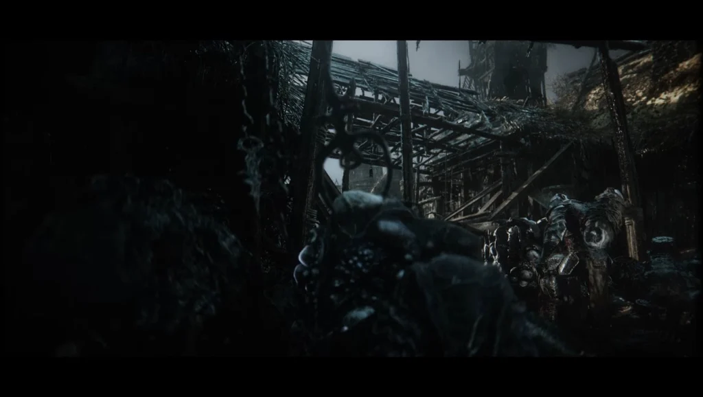 Mroczna scena wprowadzająca z Mortal Shell II, budująca ciężki klimat dark fantasy przed rozpoczęciem rozgrywki.